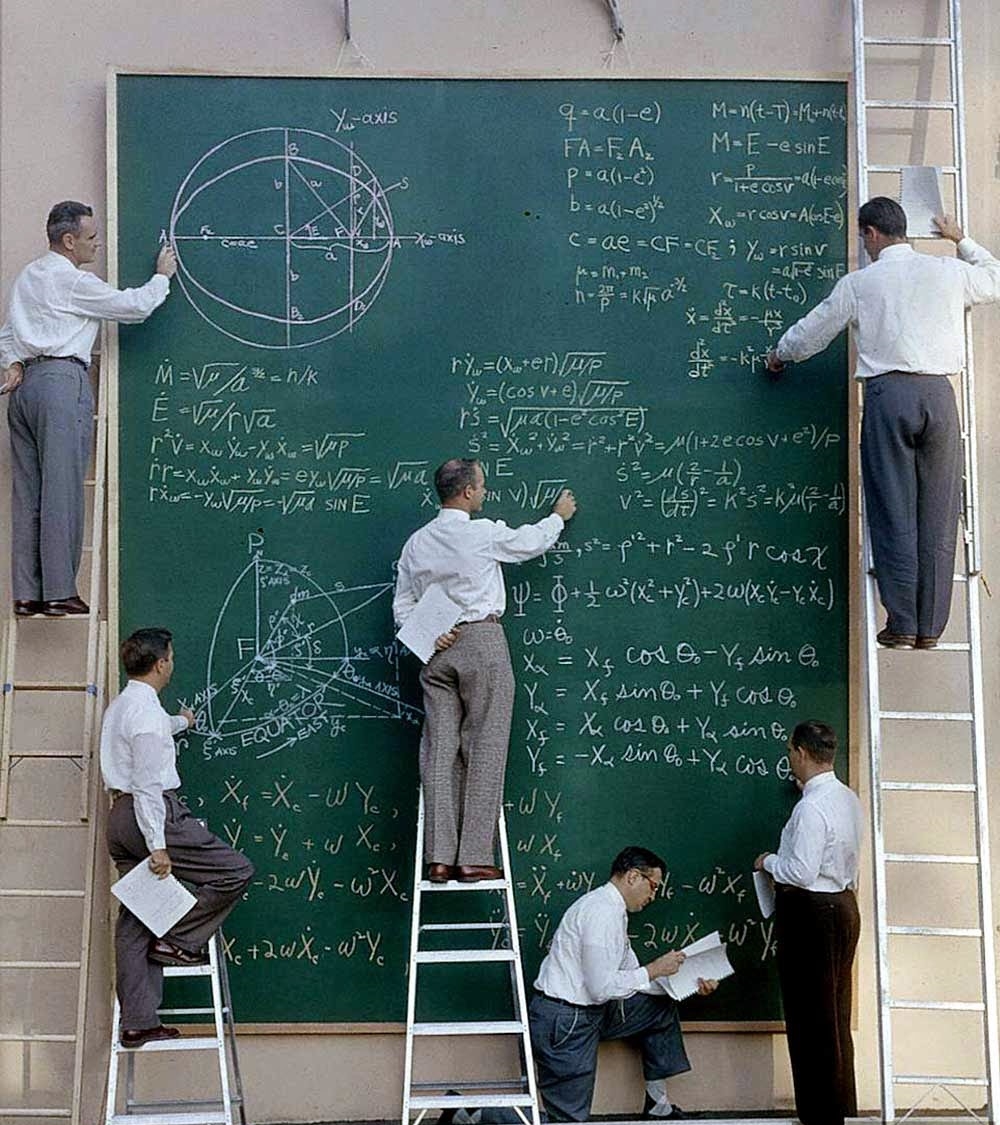 NASA scientists with their board of calculations, 1961 CROPPED
